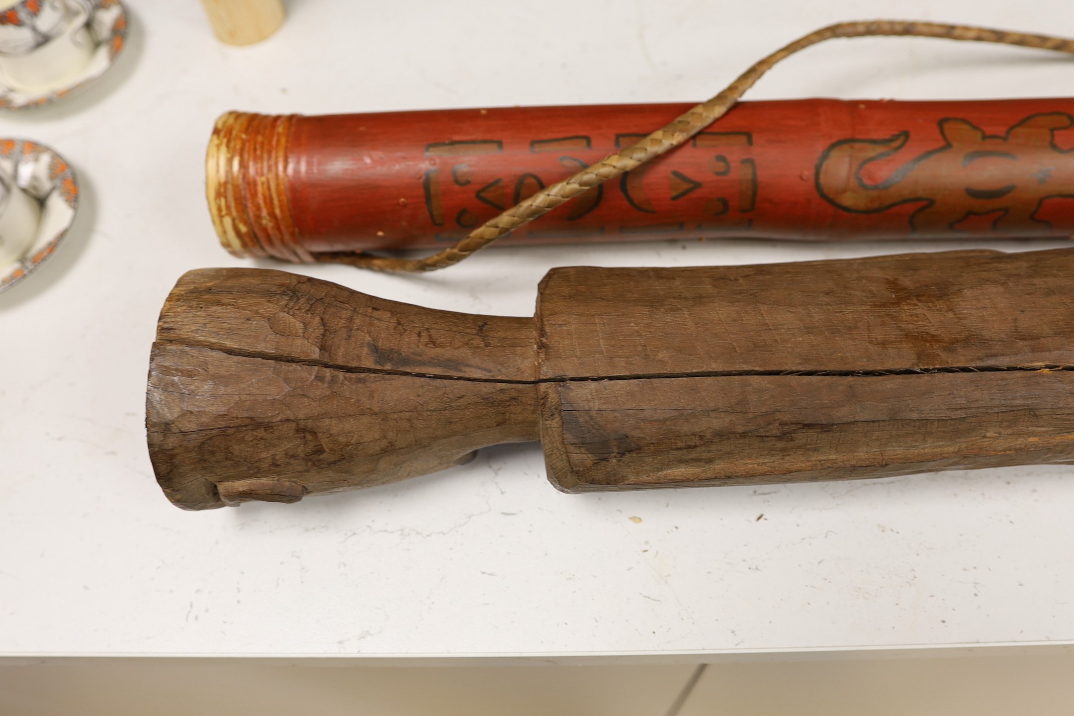 A Chinese wood grave figure possibly Han, 85.5cm high, with wooden musical rain stick